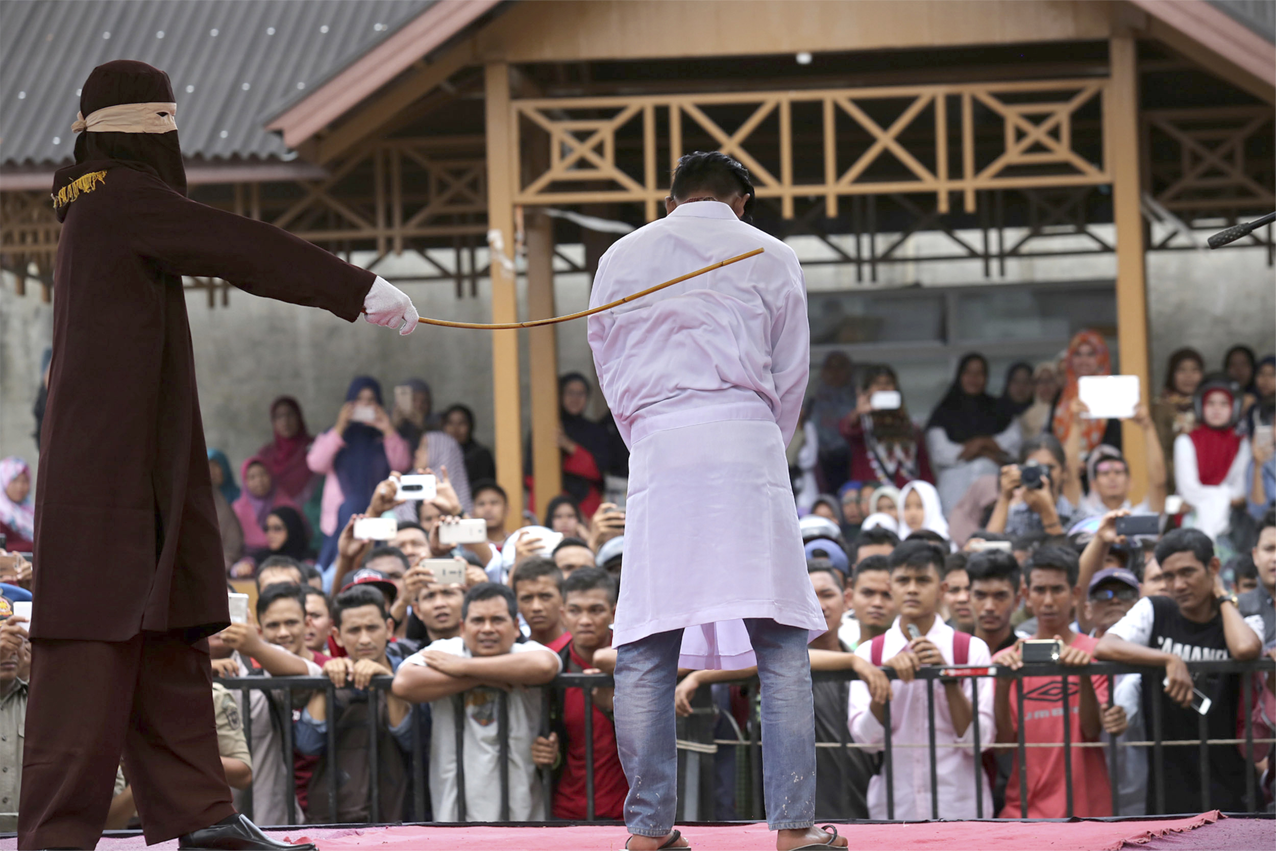 2 men in Indonesia caned dozens of times for gay sex