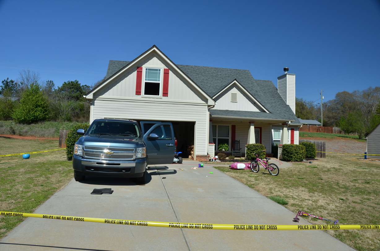 This Sunday, March 29, 2015 photo provided by the Jefferson Police Department shows the scene of an accidental shooting in Jefferson, Ga. Jaxon White had turned 3 two days earlier. His parents, Wendy Brock and Roger White Jr., were washing Roger’s pickup in the driveway. The boy climbed in the open driver’s side door, found the handgun his father kept in the center console and stood on the seat. His father, nearby, screamed the boy’s name to tell him to put down the gun, as Jaxon looked down the barrel. Then, a loud pop. The boy collapsed from a gunshot wound to the head. His pulse stopped in an ambulance. (Jefferson Police Department via AP)