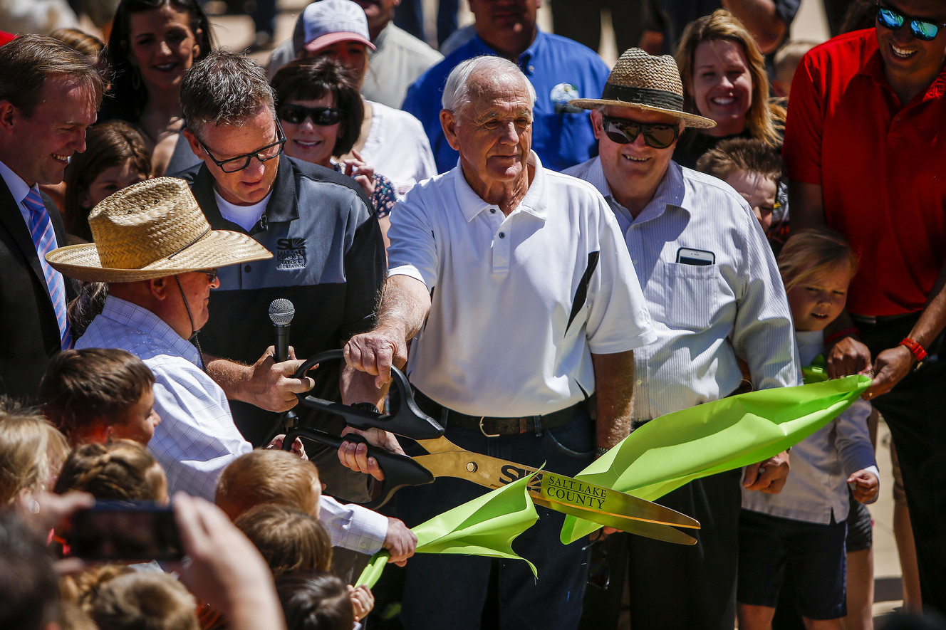 Martin Jensen, director of Salt Lake County Parks and Recreation, along with members of the Wardle family cut a ribbon. (Photo: Nicole Boliaux, Deseret News)