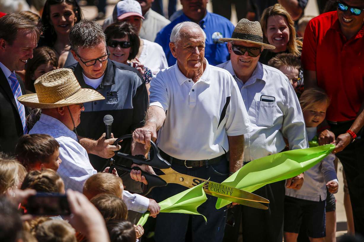 Martin Jensen, director of Salt Lake County Parks and Recreation, along with members of the Wardle family cut a ribbon. (Photo: Nicole Boliaux, Deseret News)