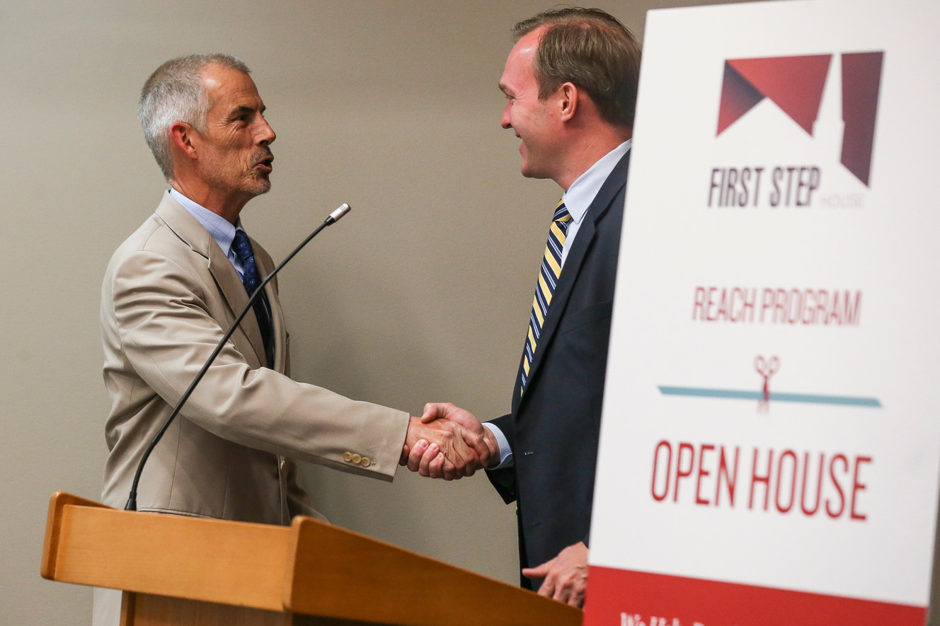 First Step House Executive Director Shawn McMillen and Salt Lake County Mayor Ben McAdams, right, shake hands at the opening of the new First Step House REACH facility in Salt Lake City on Thursday, May 25, 2017. (Photo: Spenser Heaps, Deseret News)