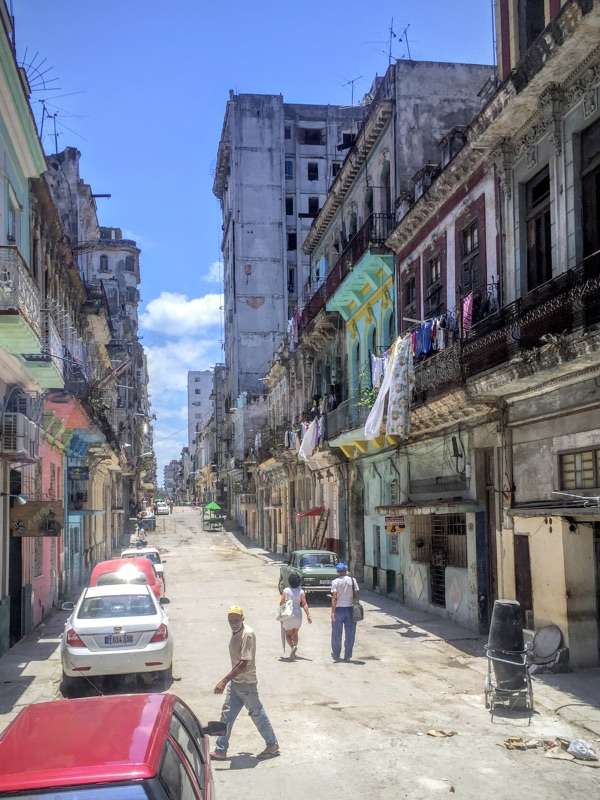 Residents walk along a street in Havana, Cuba. The World Trade Center Utah and the Salt Lake Chamber conducted a trade mission to Cuba with local business leaders in an effort to develop potential economic relationships for the mutual benefit of the state and the Caribbean nation. The U.S. has had no diplomatic relations with Cuba since 1963, but relations have eased in recent years. (Photo: Derek Miller, World Trade Center Utah)