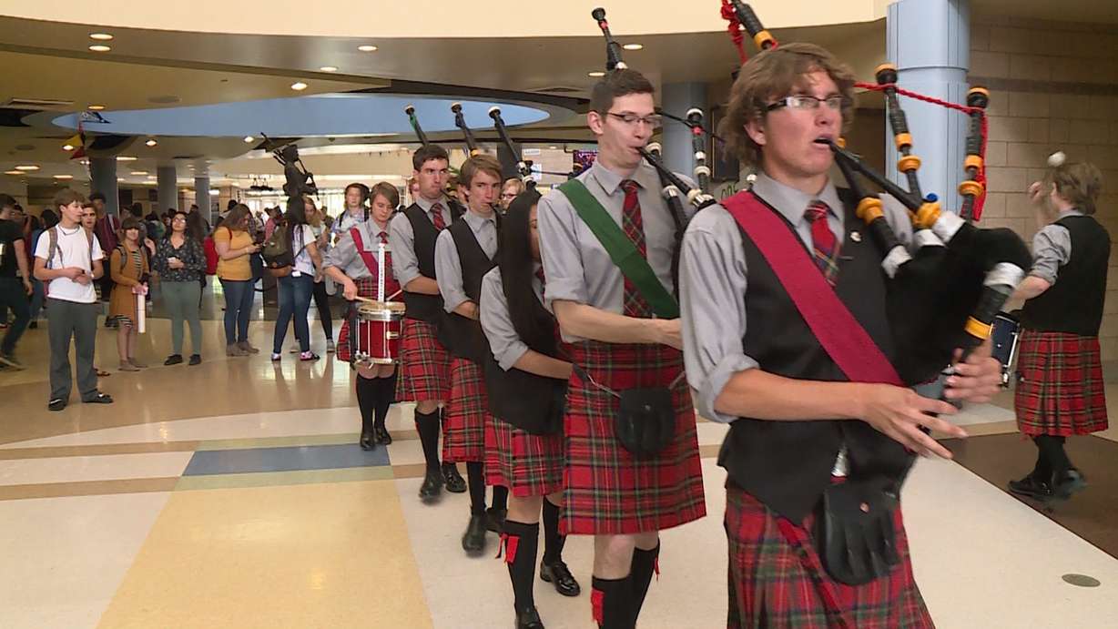 The bagpipe band marches through the school. (Photo: Ray Boone)
