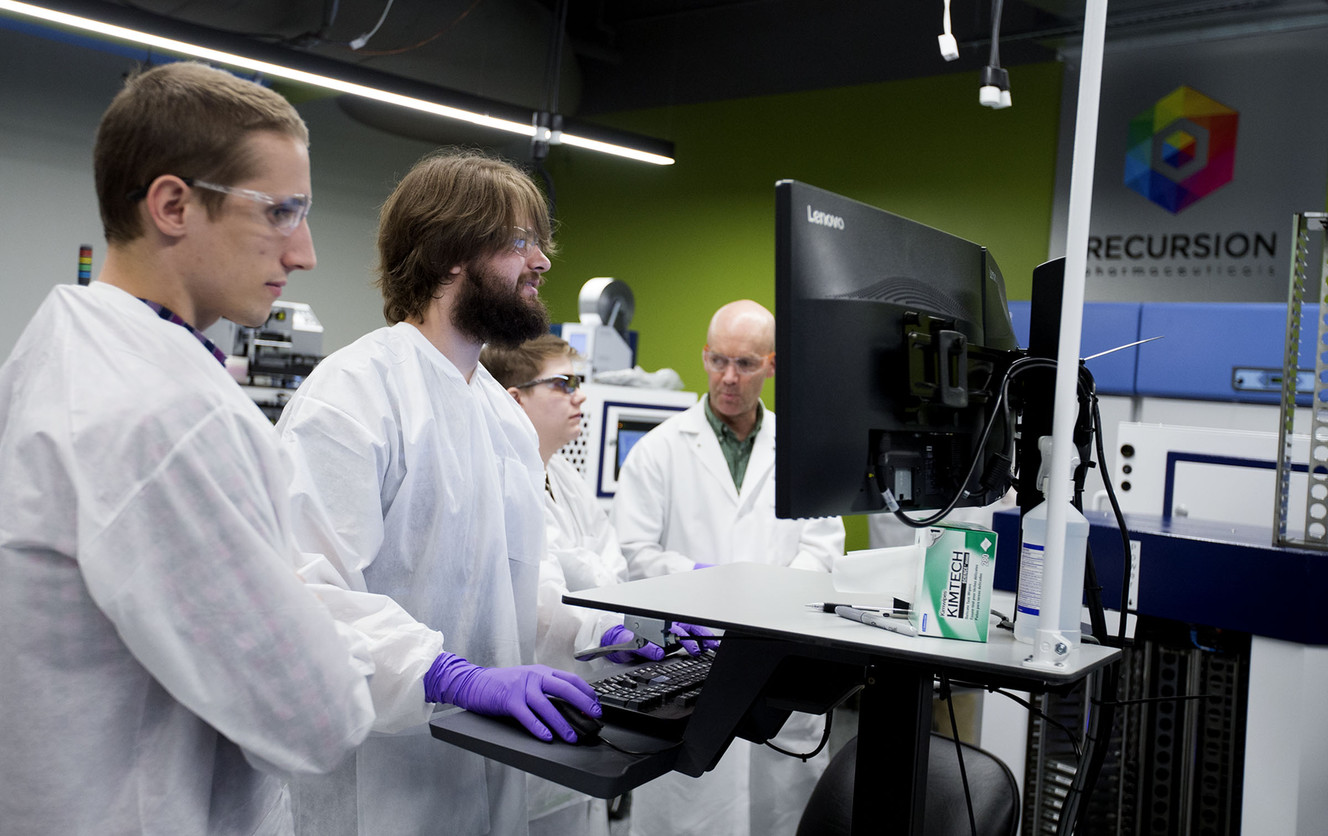 Automation scientist August Allen, technician Nick Campbell, technician Lawrie Allred and biology technician David Compton work in the robotics lab. (Photo: Laura Seitz, Deseret News)