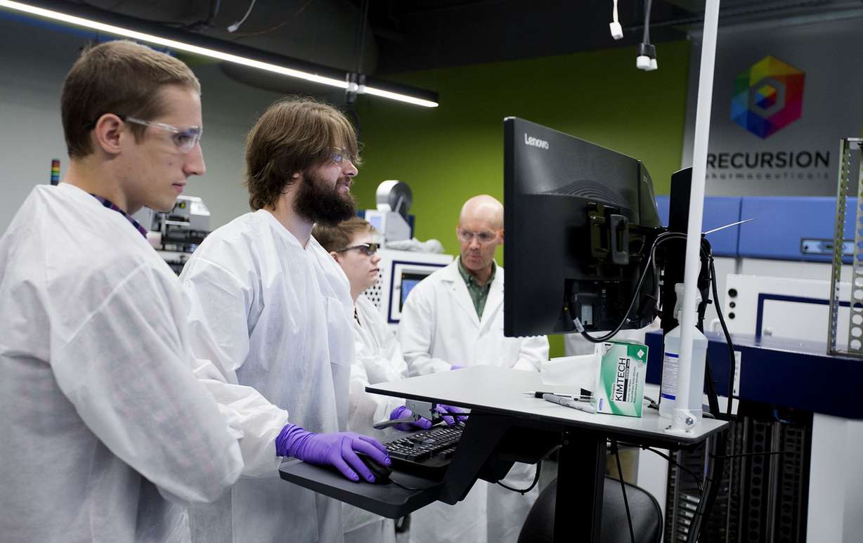 Automation scientist August Allen, technician Nick Campbell, technician Lawrie Allred and biology technician David Compton work in the robotics lab. (Photo: Laura Seitz, Deseret News)