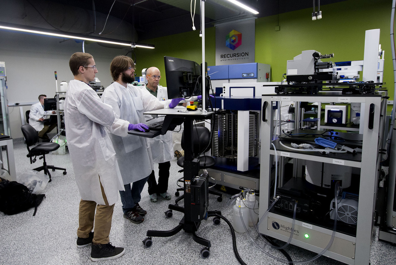 Automation scientist August Allen, technician Nick Campbell and biology technician David Compton work in the robotics lab. (Photo: Laura Seitz, Deseret News)