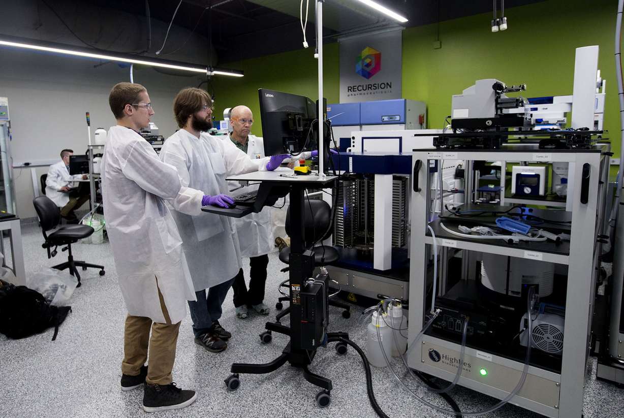 Automation scientist August Allen, technician Nick Campbell and biology technician David Compton work in the robotics lab. (Photo: Laura Seitz, Deseret News)