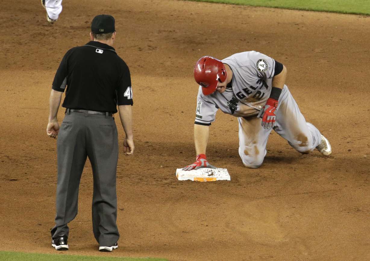 Los Angeles Angels' Mike Trout grimaces after stealing second during the fifth inning of an interleague baseball game against the Miami Marlins, Sunday, May 28, 2017, in Miami. Trout injured his thumb on the play. (Photo: Lynne Sladky, AP Photo)