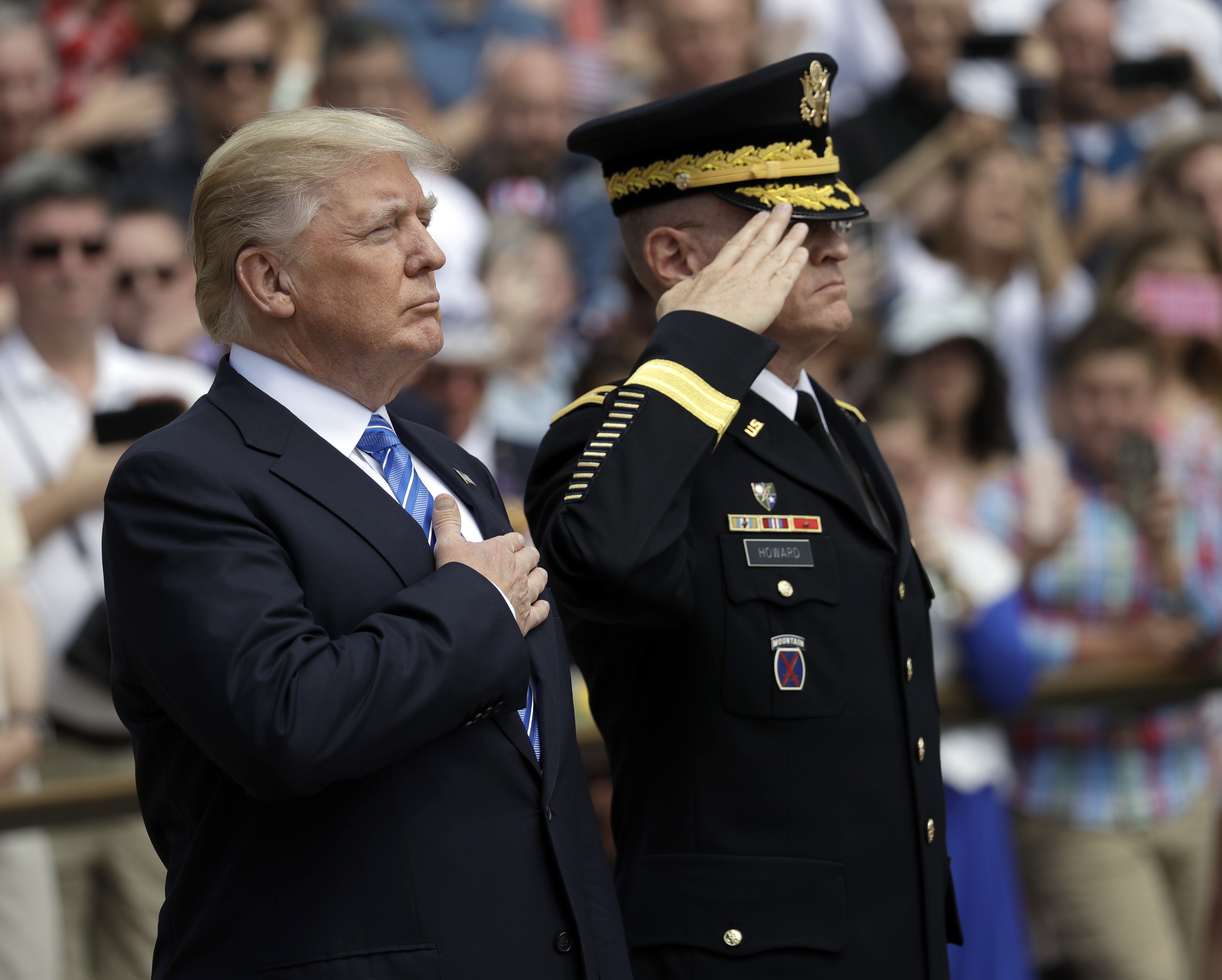 Trump pays somber tribute to fallen troops on Memorial Day