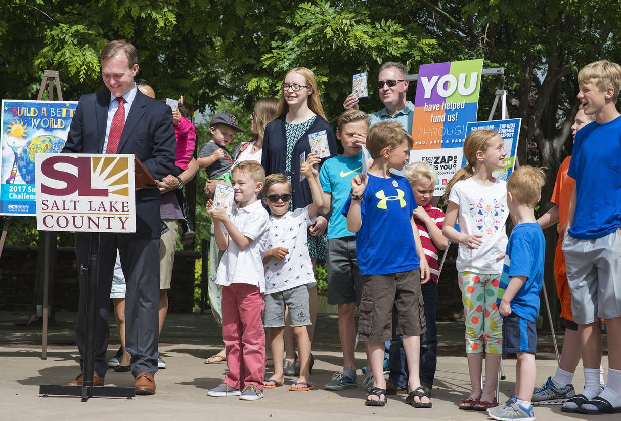 Salt Lake County Mayor Ben McAdams asks to see the kids' new summer passports during his speech at the official kickoff for Salt Lake County's Kids Summer Passport tour at the Conservations Garden Park in West Jordan on Thursday, June 1, 2017. (Photo: Kelsey Brunner, Deseret News)