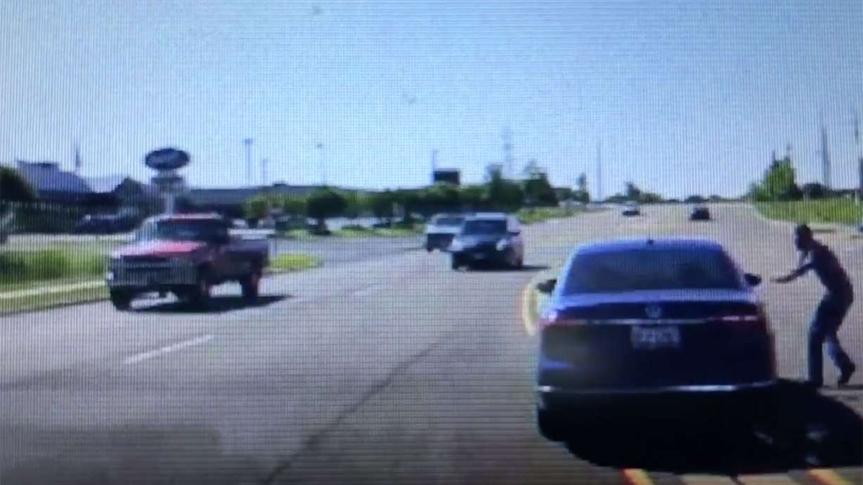 Man jumps into moving car to save driver having a seizure