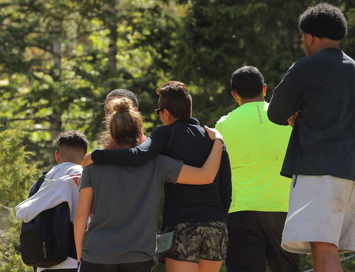 Relatives of a 22-year-old man who fell while hiking Bell Canyon watch as members of the Salt Lake County Search and Rescue team work to recover his body on Monday, June 5, 2017. (Photo: Scott G Winterton, Deseret News)