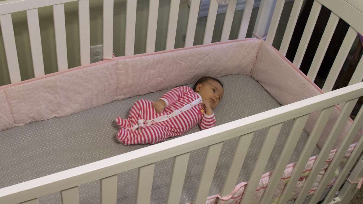Babies may sleep longer in their own rooms, study says