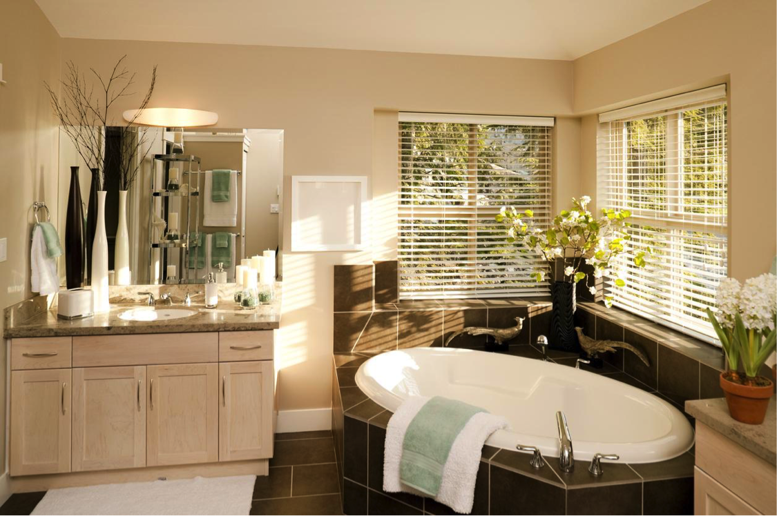 New towels and rugs freshen this bathroom at a minimal cost