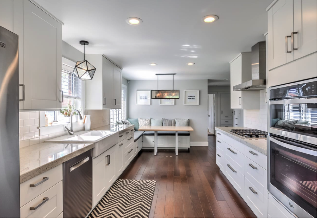 New lighting adds flair to this white kitchen