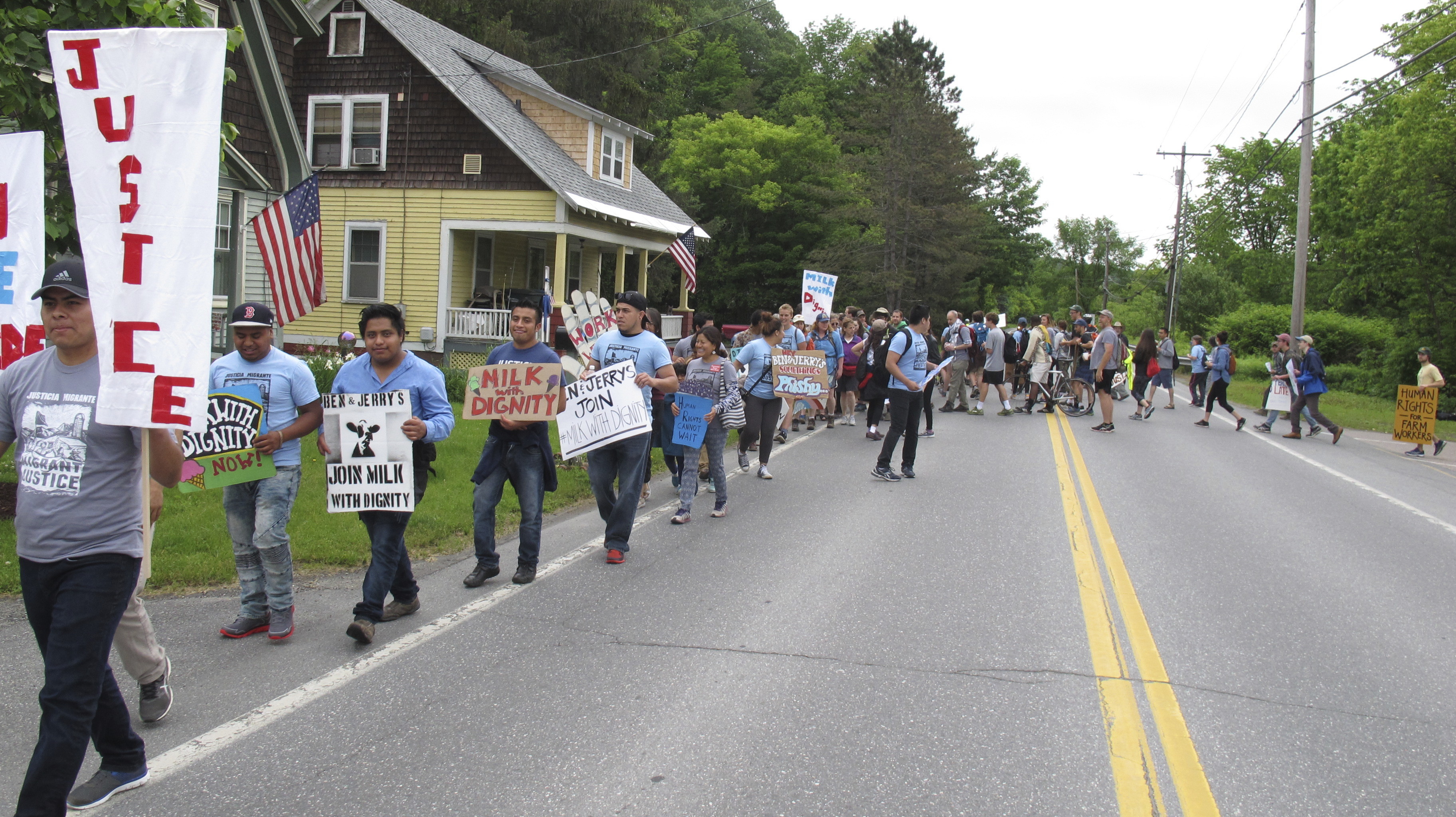 Scores of farm workers, activists march on Ben & Jerry's
