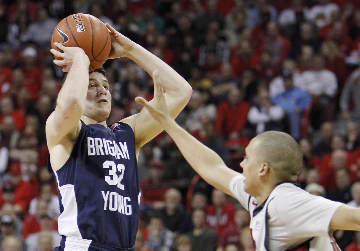 BYU's Jimmer Fredette shoots over UNLV's Derrick Jasper during the first half of an NCAA college basketball game against UNLV Wednesday, Jan. 5, 2011, in Las Vegas. (Photo: Isaac Brekken, AP)