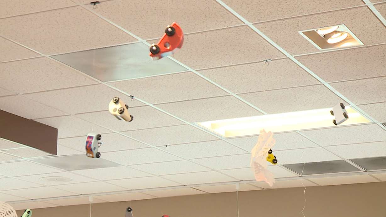 Some of Thacker's toy cars hang from the ceiling at a Chick-Fil-A restaurant in Taylorsville. (Photo: Ray Boone)