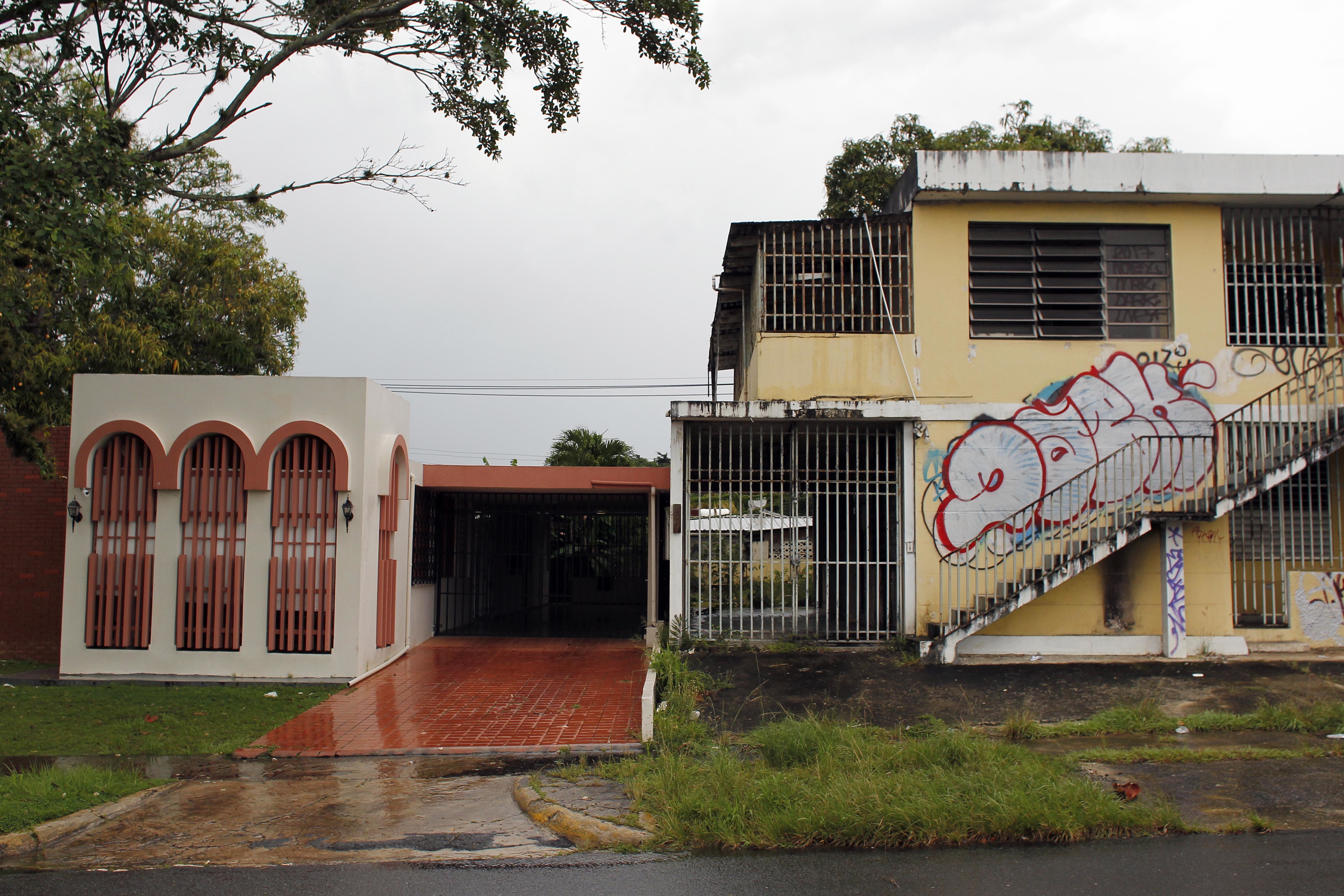 Puerto Rico families fight, flee a surge in foreclosures