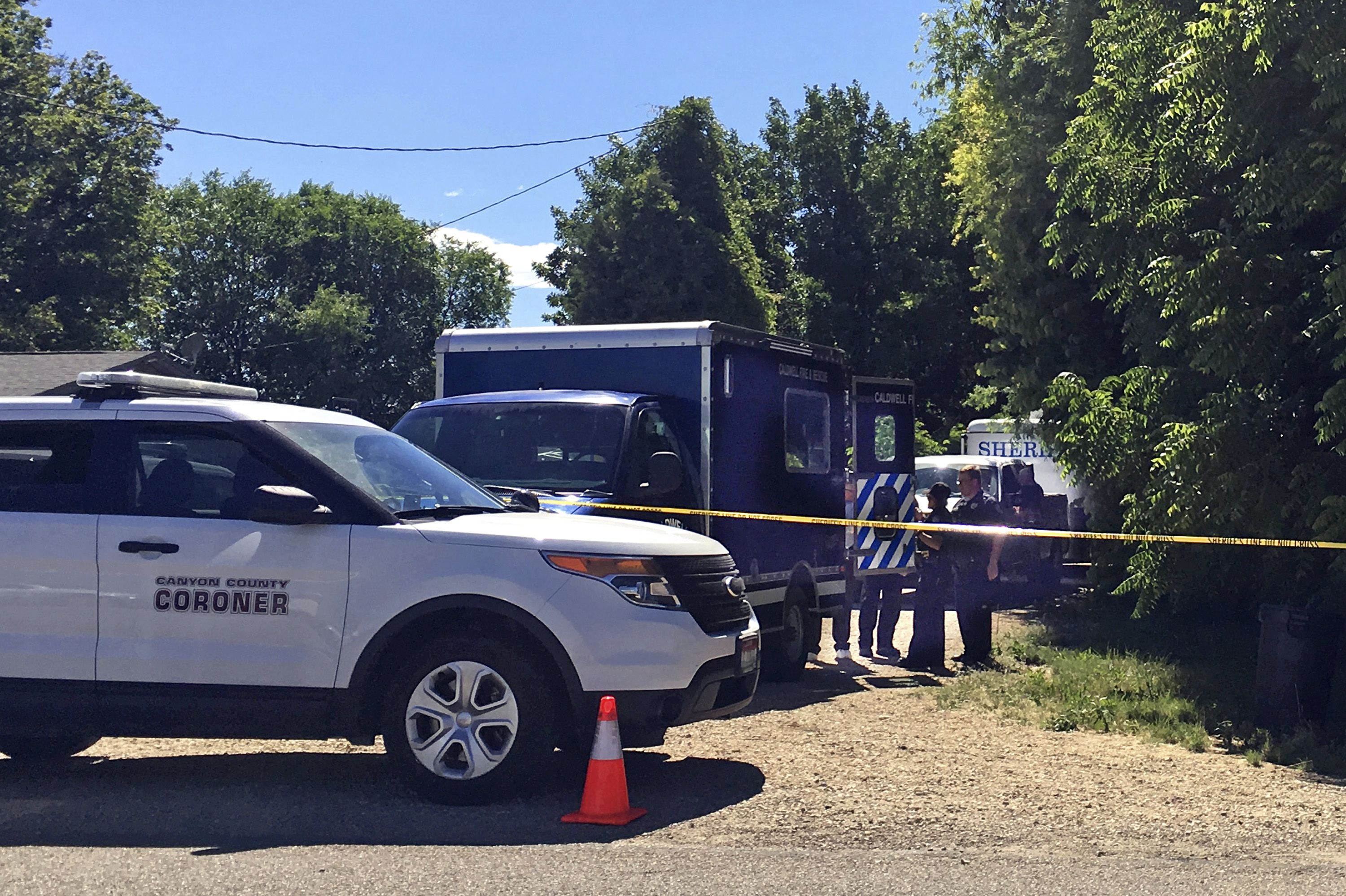Authorities investigate a scene in Caldwell, Idaho, on June 19, 2017. Yellowstone National Park rangers and Wyoming sheriff's deputies seeking the murder suspect held a vacationing family at gunpoint without adequate cause for an hour, a lawsuit claimed Tuesday.