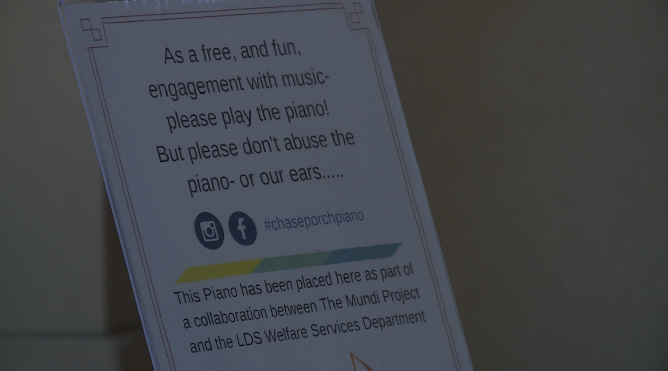 A sign displayed on a piano placed at Liberty Park by Deseret Industries encourages passers-by to play it. In Liberty Park, Wednesday, June 21, 2017. (Photo: Steve Breinholt, KSL TV)