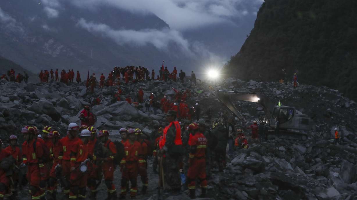 15 bodies found after landslide buries scores in China