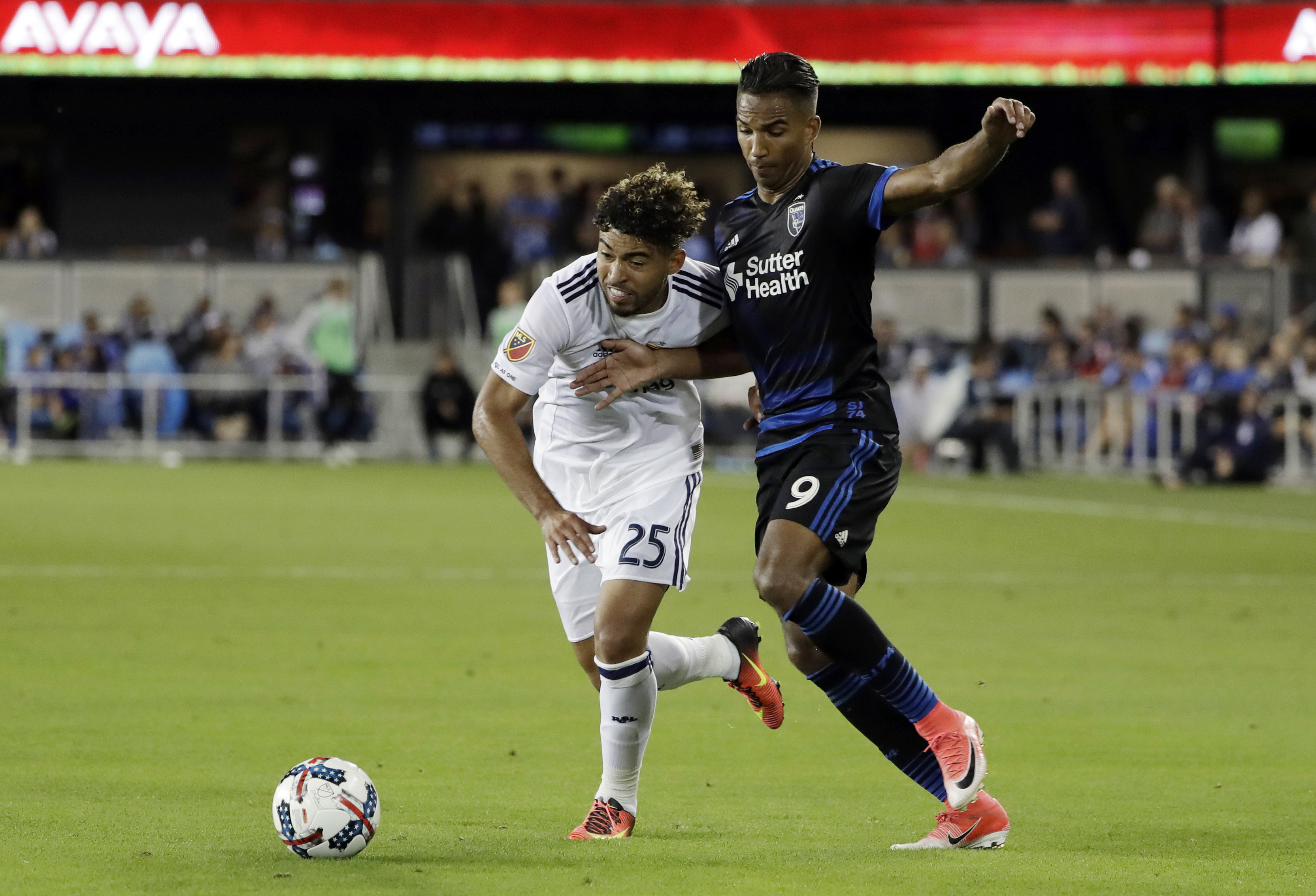 Real Salt Lake midfielder Danilo Acosta (25) is defended by San Jose Earthquakes forward Danny Hoesen (9) during the second half of an MLS soccer match Saturday, June 24, 2017, in San Jose, Calif. (Photo: Marcio Jose Sanchez, AP)