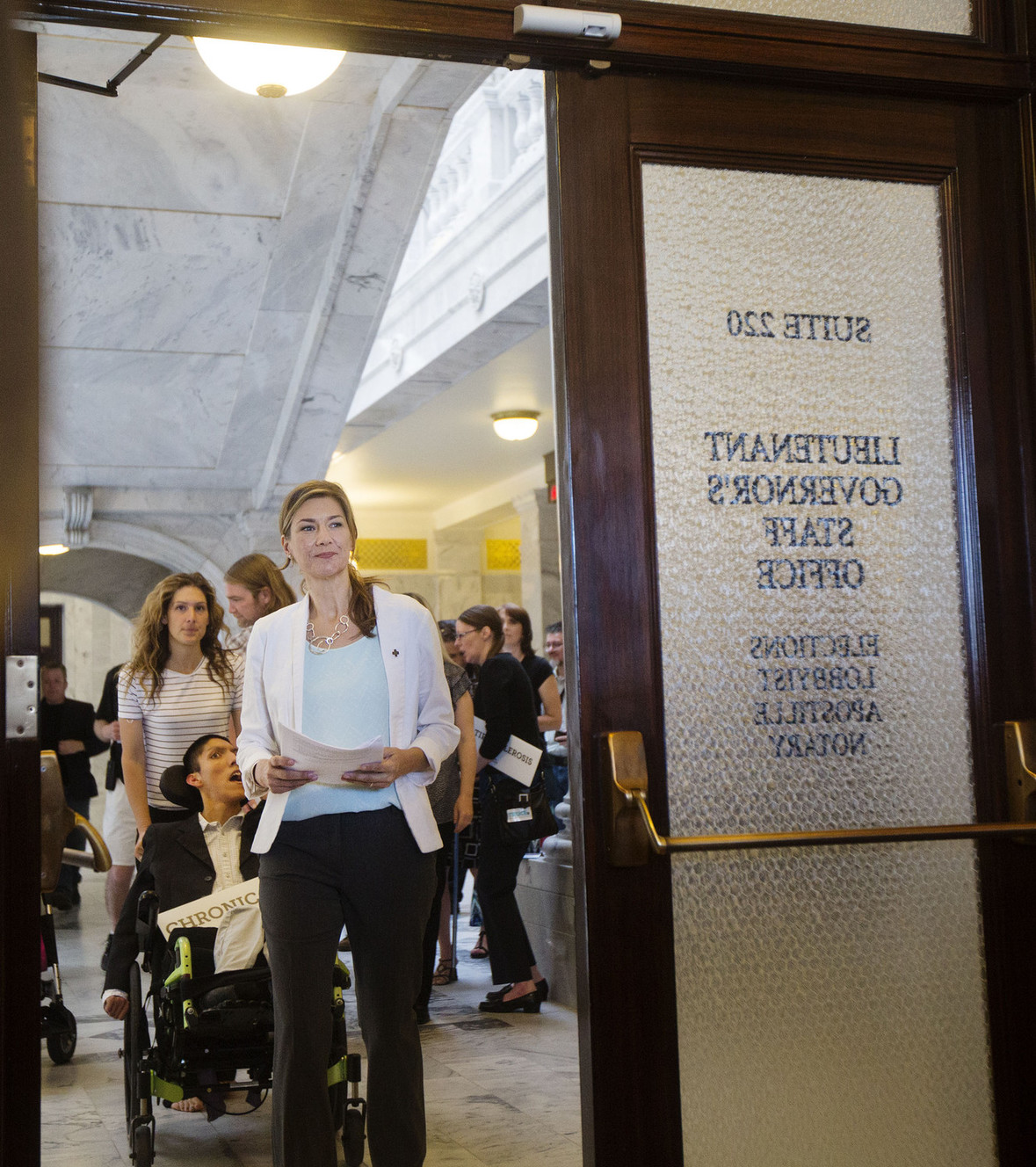 Christine Stenquist walks through the doors of the Utah Lieutenant Governor’s Office followed by other supporters and legislators to turn in the 2018 medical cannabis initiative filing in Salt Lake City on Monday, June 26, 2017. (Photo: Kelsey Brunner, Deseret News)