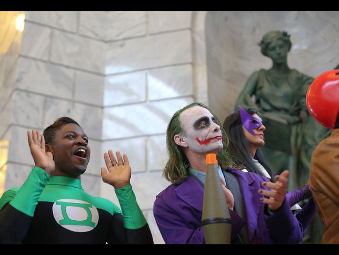 Victor Sine, as the Green Lantern, and Ryan Hahn, as the Joker, applaud as the guest lineup for this fall's Salt Lake Comic Con is announced during a press conference at the Capitol in Salt Lake City on Wednesday, May 17, 2017. (Photo: Laura Seitz, Deseret News)