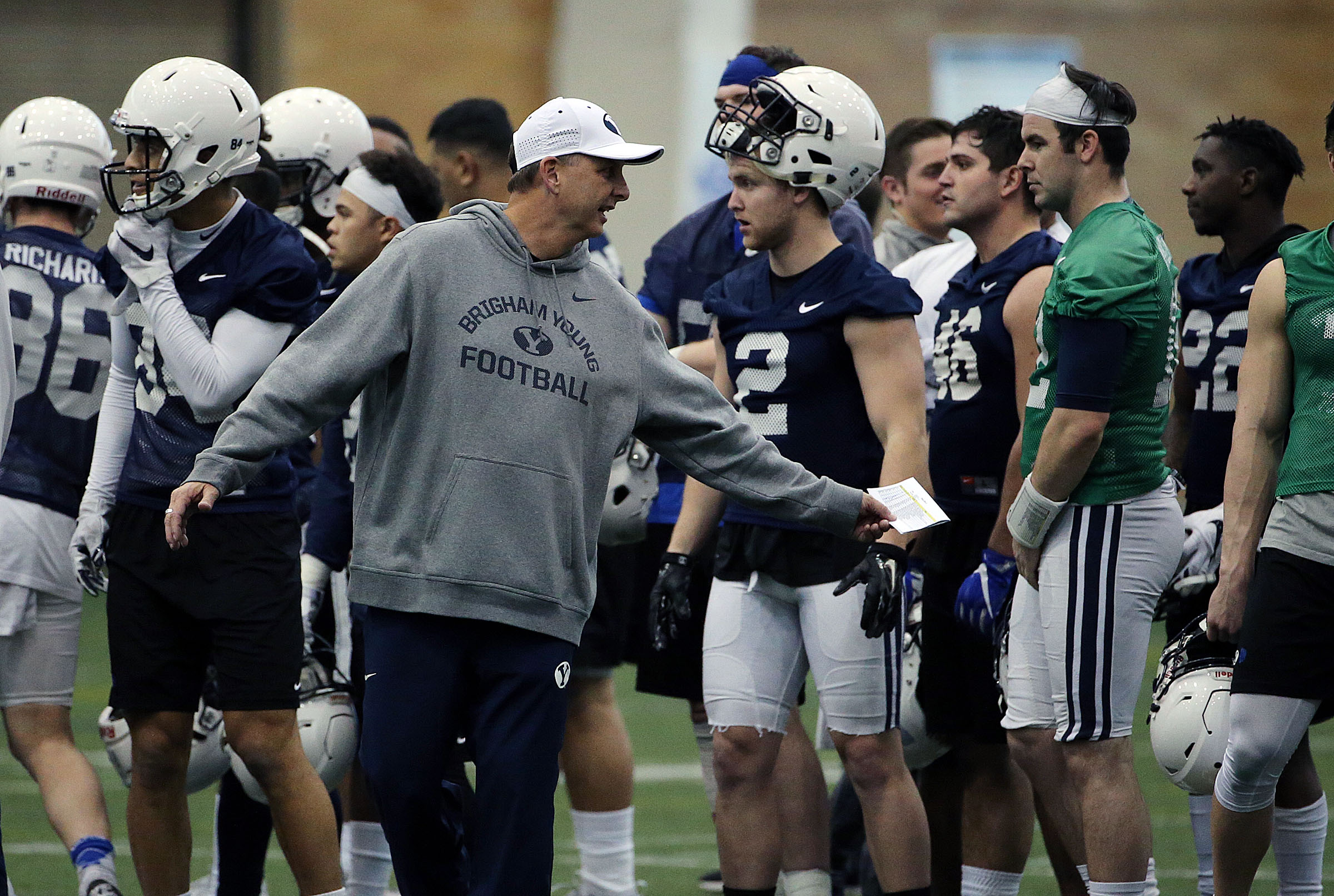 Offensive coordinator and quarterbacks coach Ty Detmer talks with quarterback Tanner Mangum during Brigham Young University football practice in Provo on Monday, Feb. 27, 2017. (Photo: Ravell Call, Deseret News)