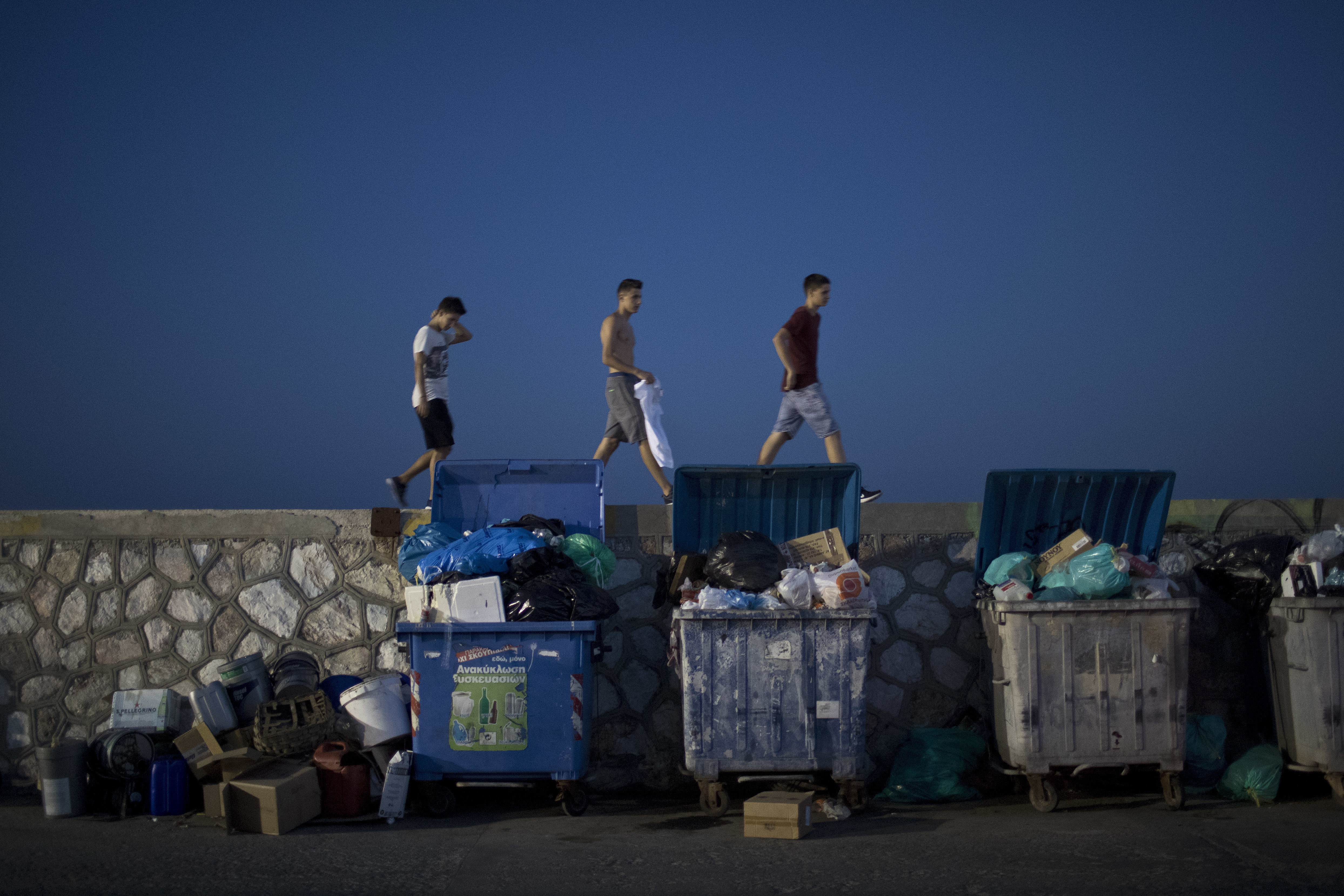 Greek trash collectors back to work after 2-week protest