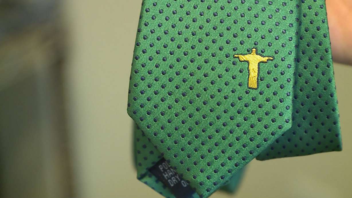 Noel Lopez shows off his "Brazil" tie, one of his top sellers. (Photo: Ray Boone, KSL TV)