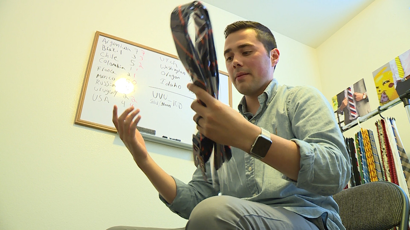 Noel Lopez works on a shipment of "Utah" ties while explaining how he came up with the idea for his business. (Photo: Ray Boone, KSL TV)