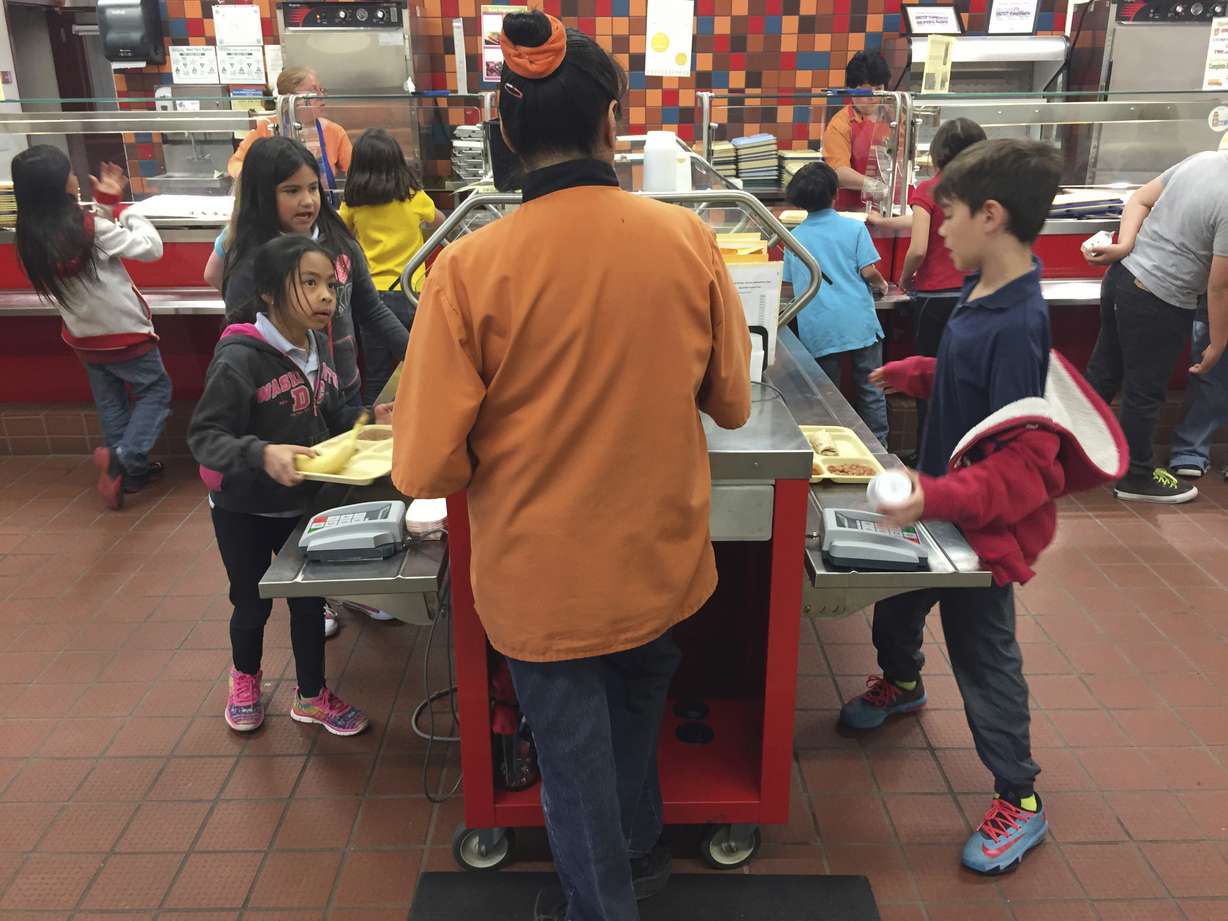 In this Thursday, May 4, 2017 photo, second grade students Angelina Lopez, left, and Nasim Hamdouni, right, enter a student account code to track lunch purchases at Gonzales Community School in Santa Fe, N.M. Photo: AP Photo