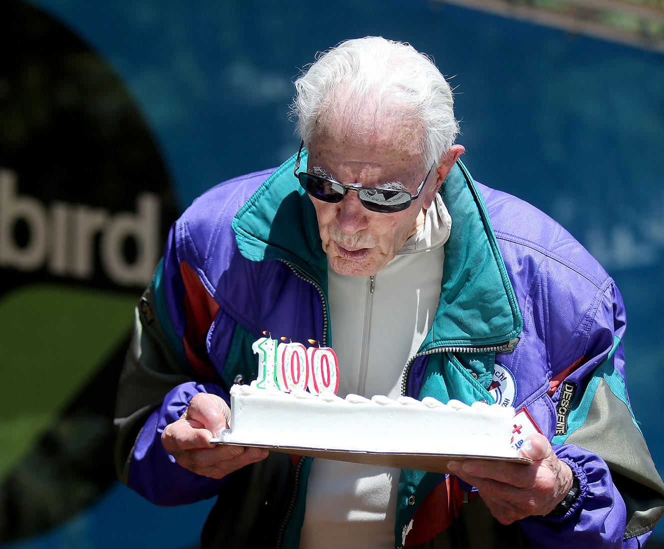 George Jedenoff blows out the candles on his birthday cake after skiing on his 100th birthday at Snowbird in Little Cottonwood Canyon on Wednesday, July 5, 2017. (Photo: Kristin Murphy, Deseret News)