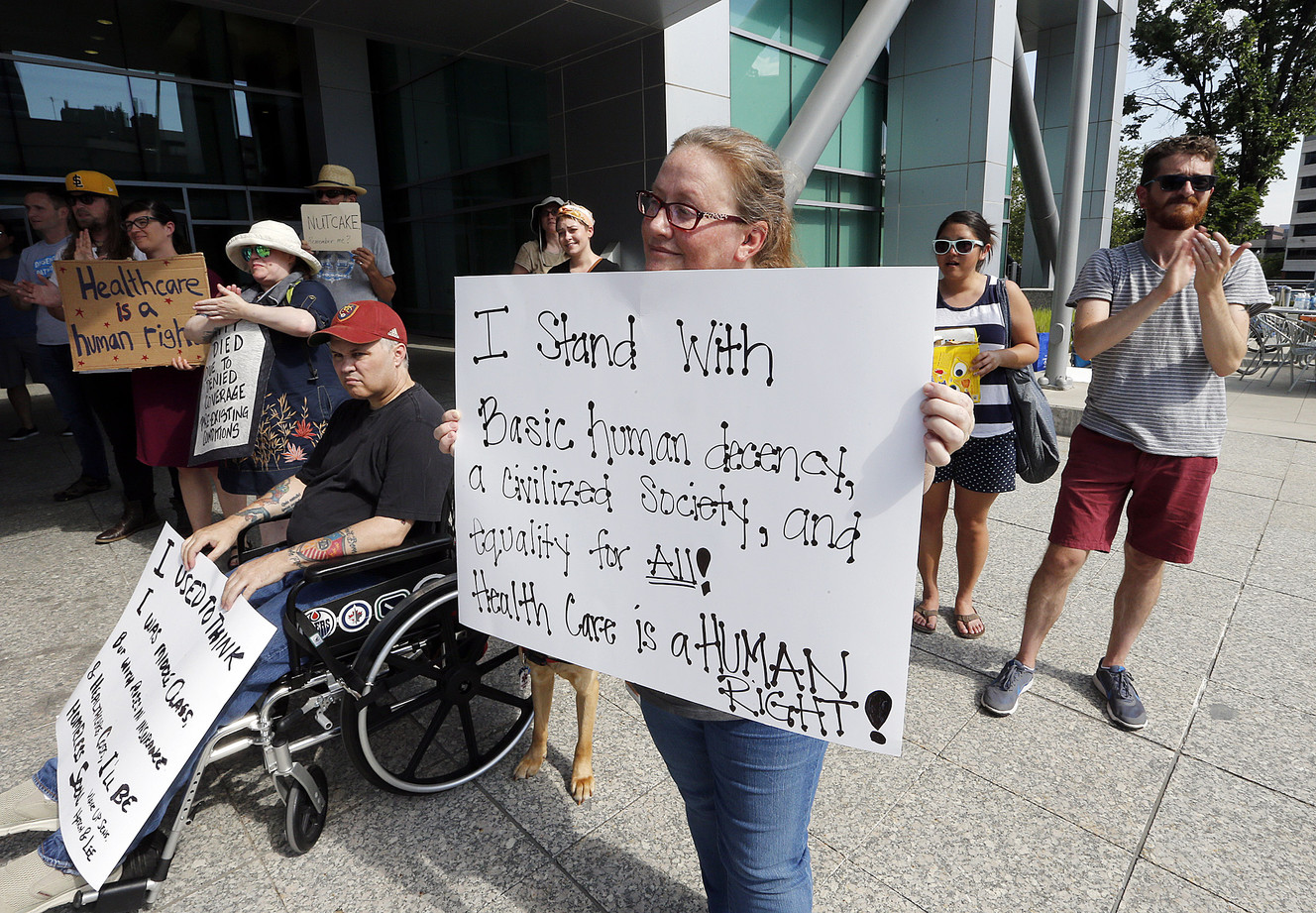Stephenie Magdiel and others rally against the Better Care Reconciliation Act at the Wallace F. Bennett Federal Building in Salt Lake City on Thursday, July 6, 2017. (Photo: Ravell Call, Deseret News)