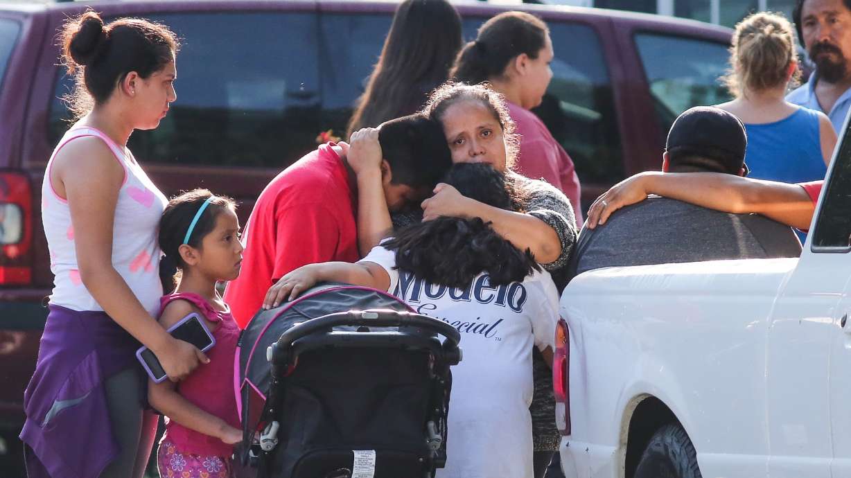 The Latest: Mom charged in kids' deaths in country illegally