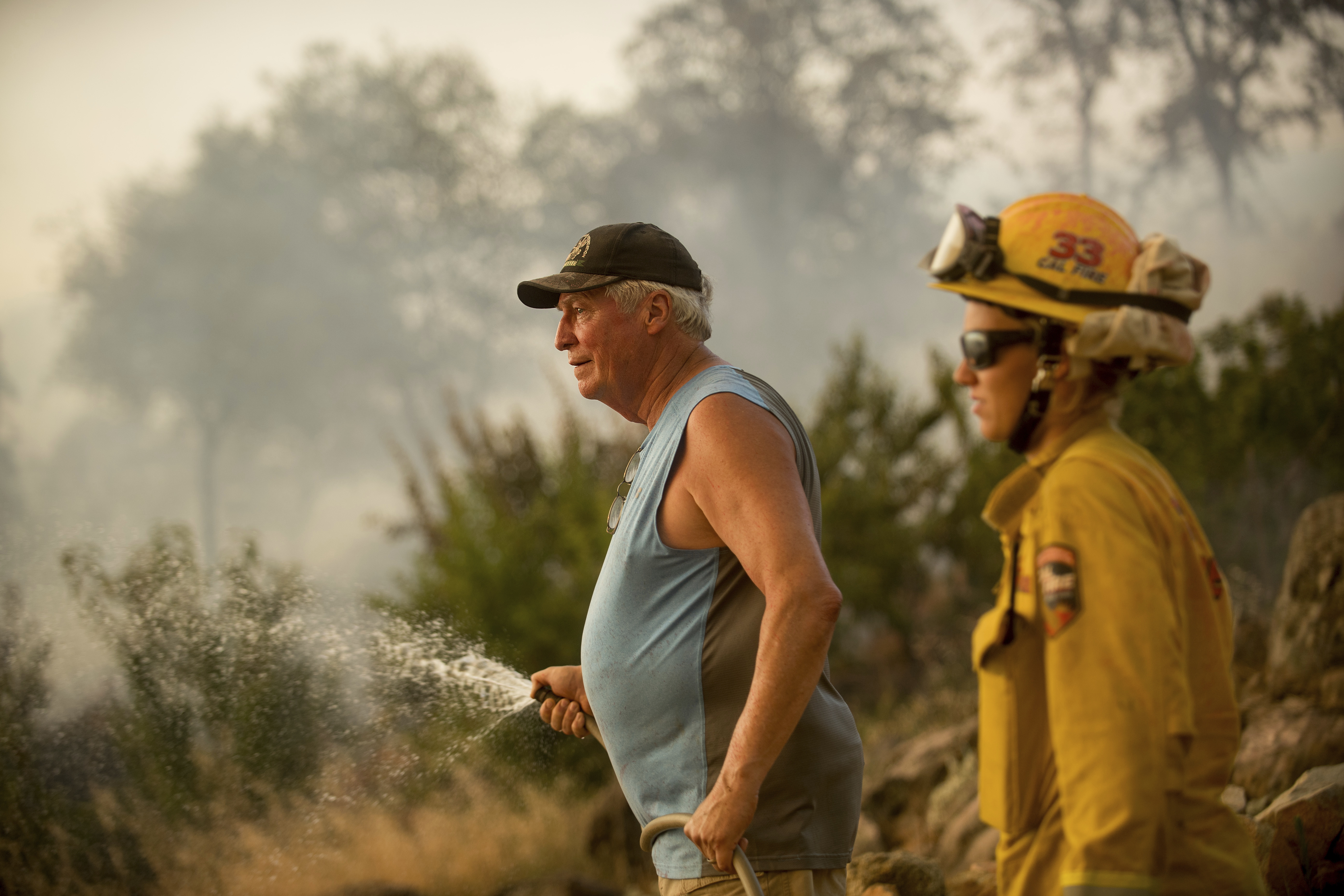Thousands flee wildfires burning in the US and Canada