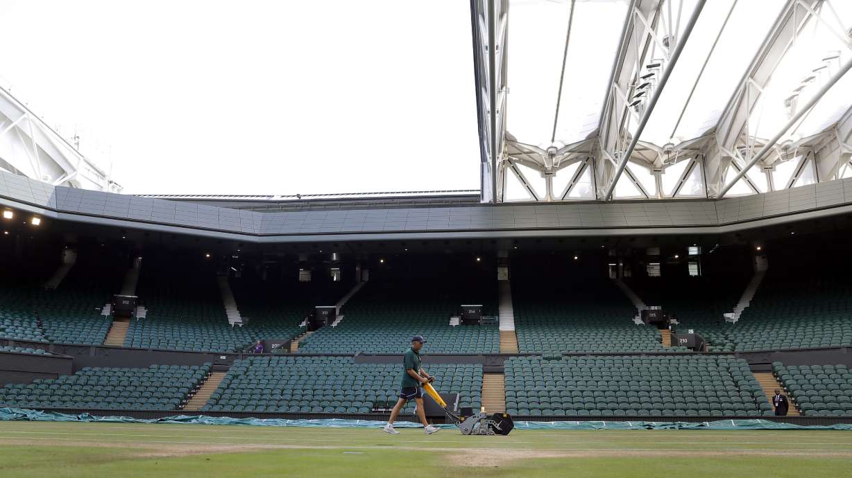 Every morning, they mow, paint, mop Wimbledon's grass courts