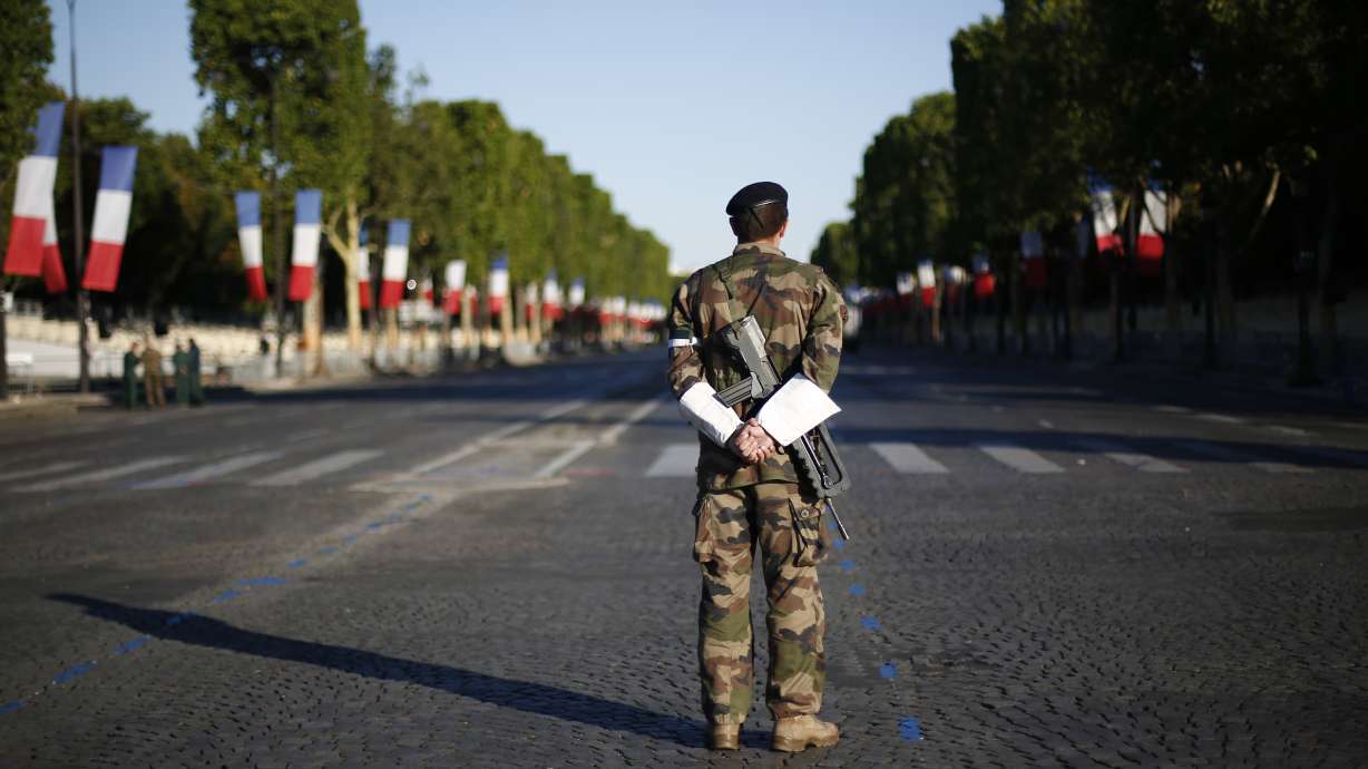 The Latest: Trump says he and Macron talked trade, military