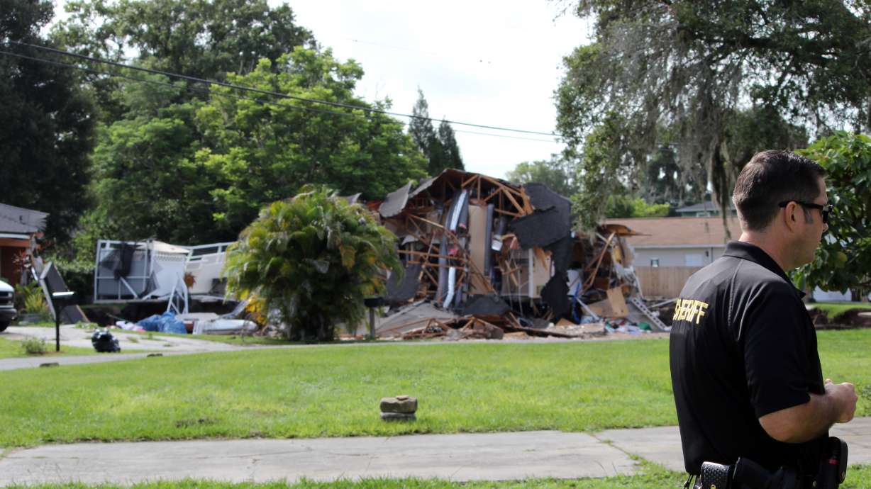 Sinkhole stops growing after swallowing 2 houses in Florida