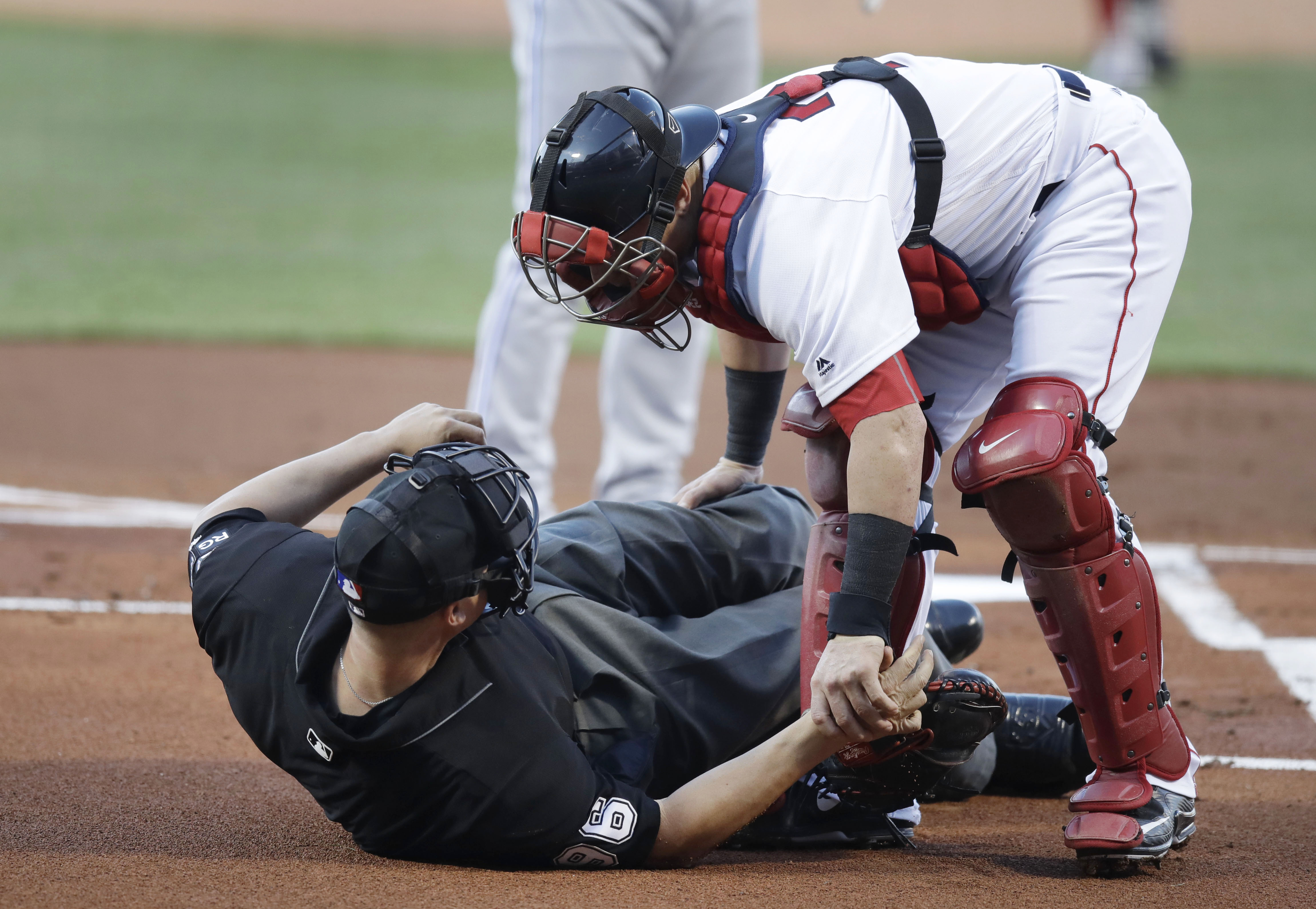 Home plate umpire Chris Segal hit by Josh Donaldson's bat