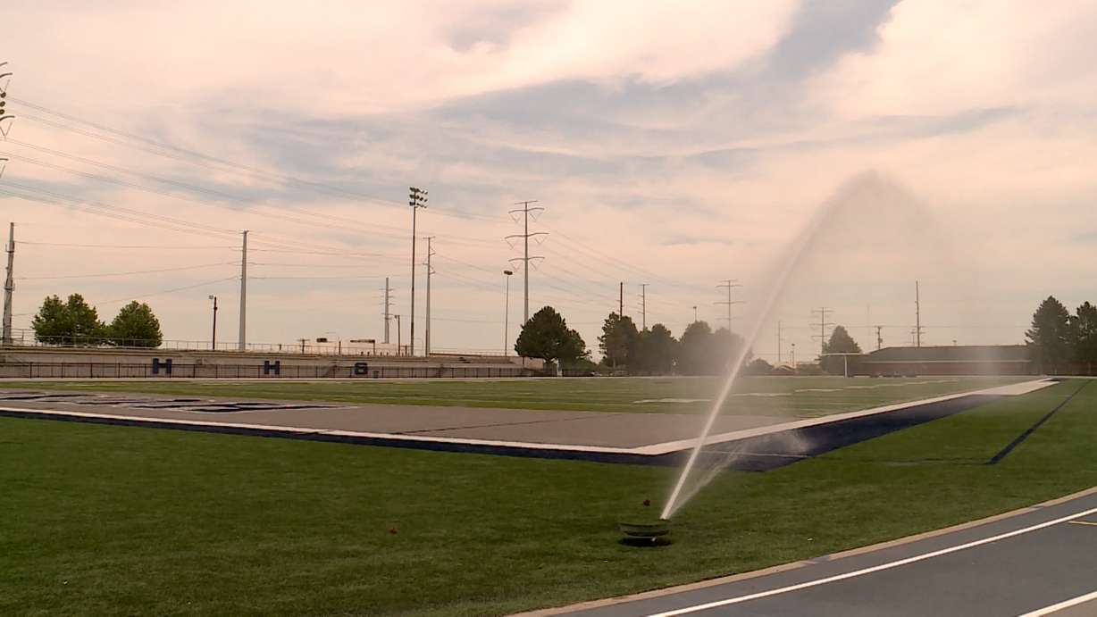 High schools in the Granite School District have installed water cannons to spray and cool down the artificial turf before athletes are allowed on the field. (Photo: KSL TV)