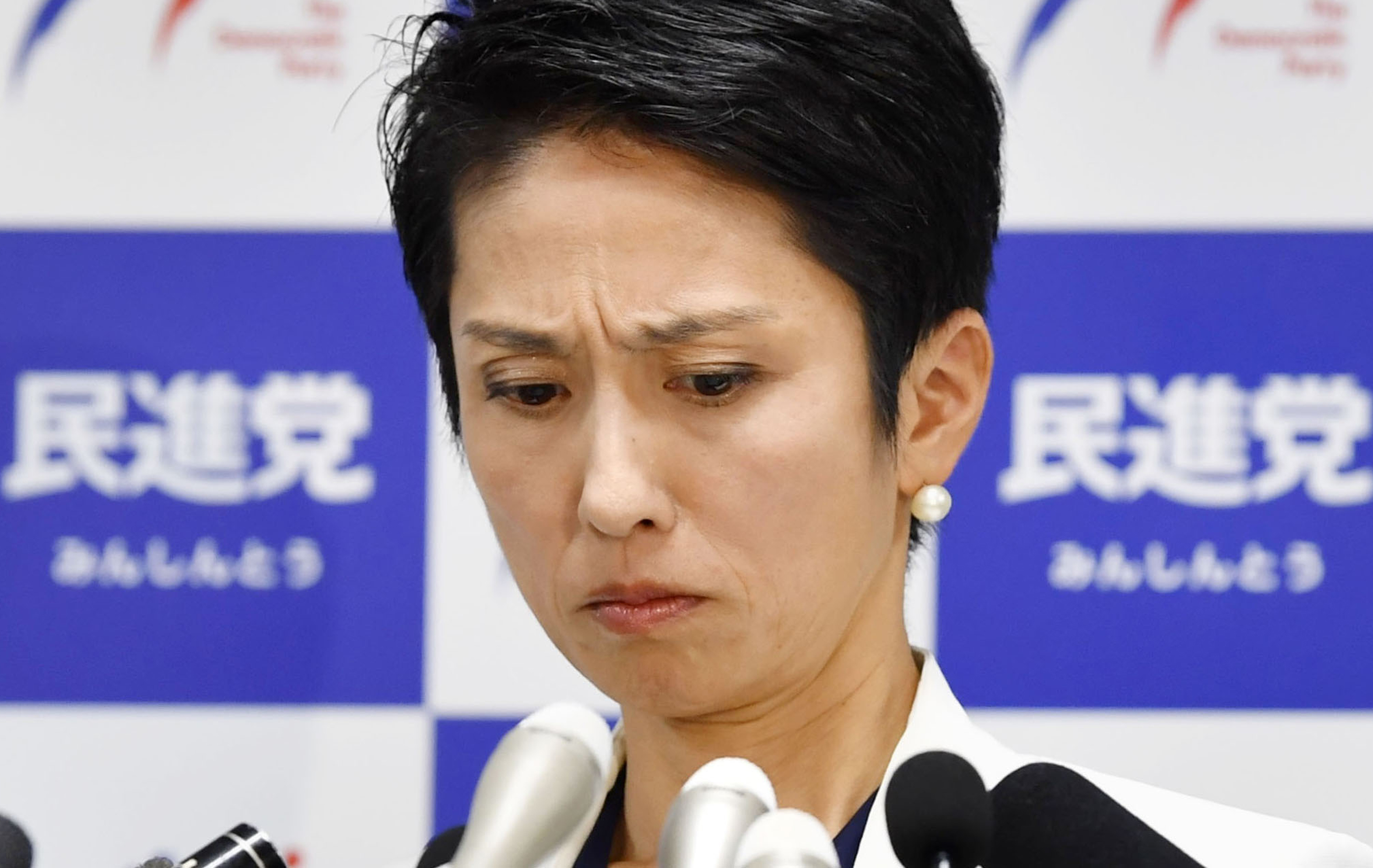 Japan lawmaker shows legal records to prove nationality