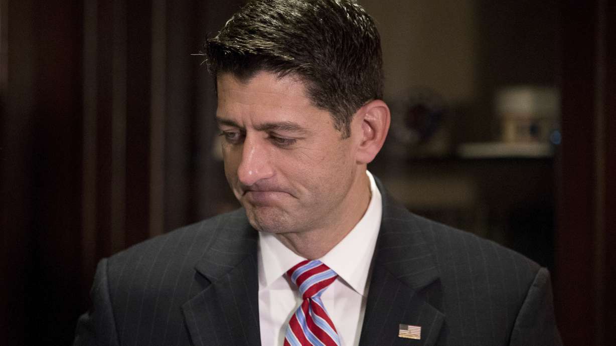 Ryan pitches tax reform at shoe factory as protesters gather