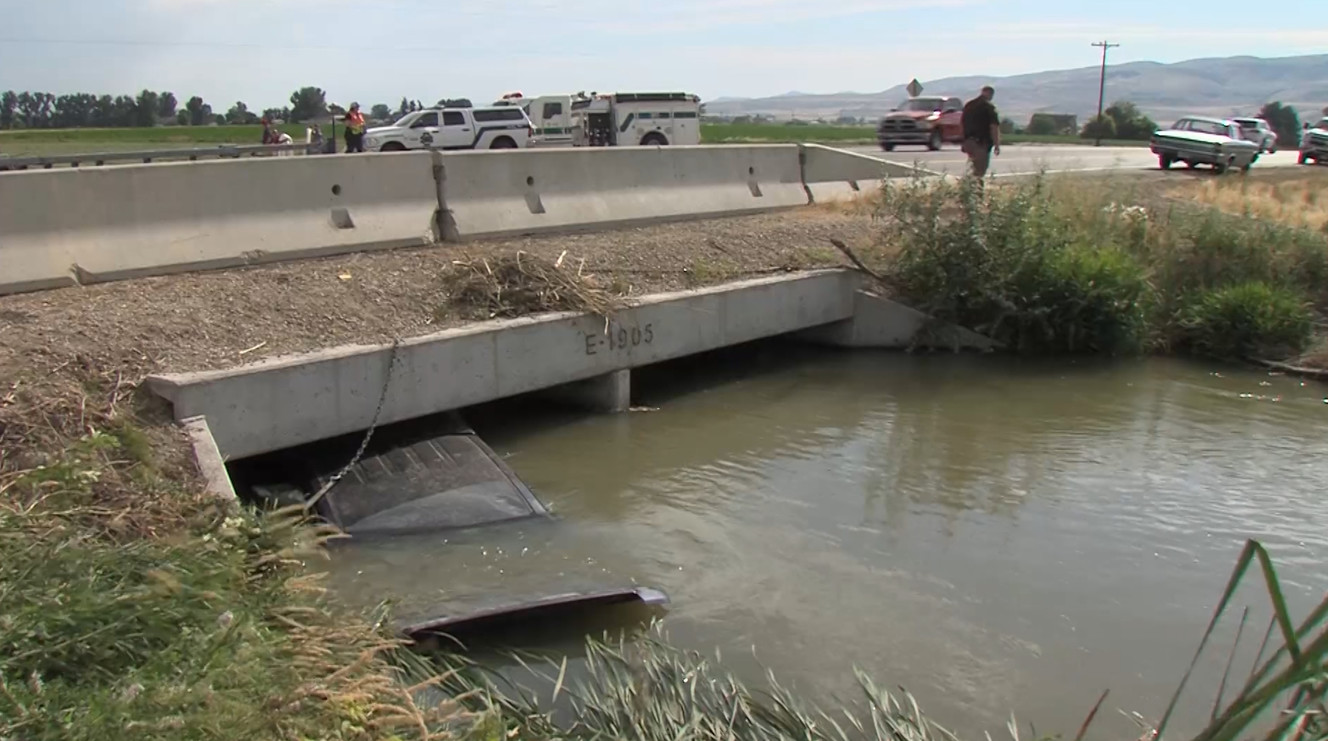 Adam Blanchard, a Fielding Fire Department volunteer, Utah Highway Patrol trooper Justin Zilles and a third man ran into the canal after Norman LaBarge, of Tremonton, lost control of his truck Wednesday, July 19, 2017, on state Route 30 just west of Bear Hollow in Box Elder County. (Photo: Brian Champagne, Deseret News)