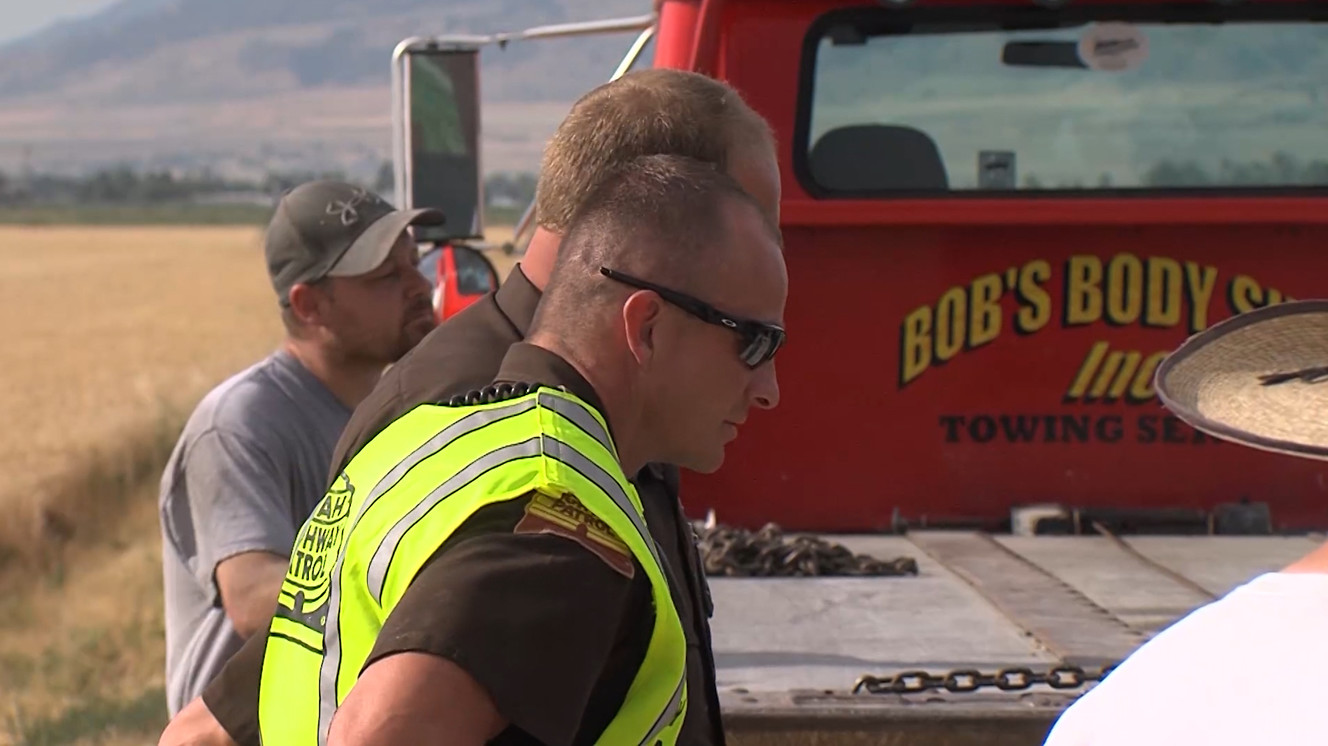 Utah Highway Patrol trooper Justin Zilles along with two other men helped pull 79-year-old Norman LaBarge from his truck after he drove it into a canal on state Route 30, Wednesday, July 19, 2017, just west of Bear Hollow in Box Elder County. LaBarge, who is diabetic, only had minor cuts. (Photo: Brian Champagne, Deseret News)