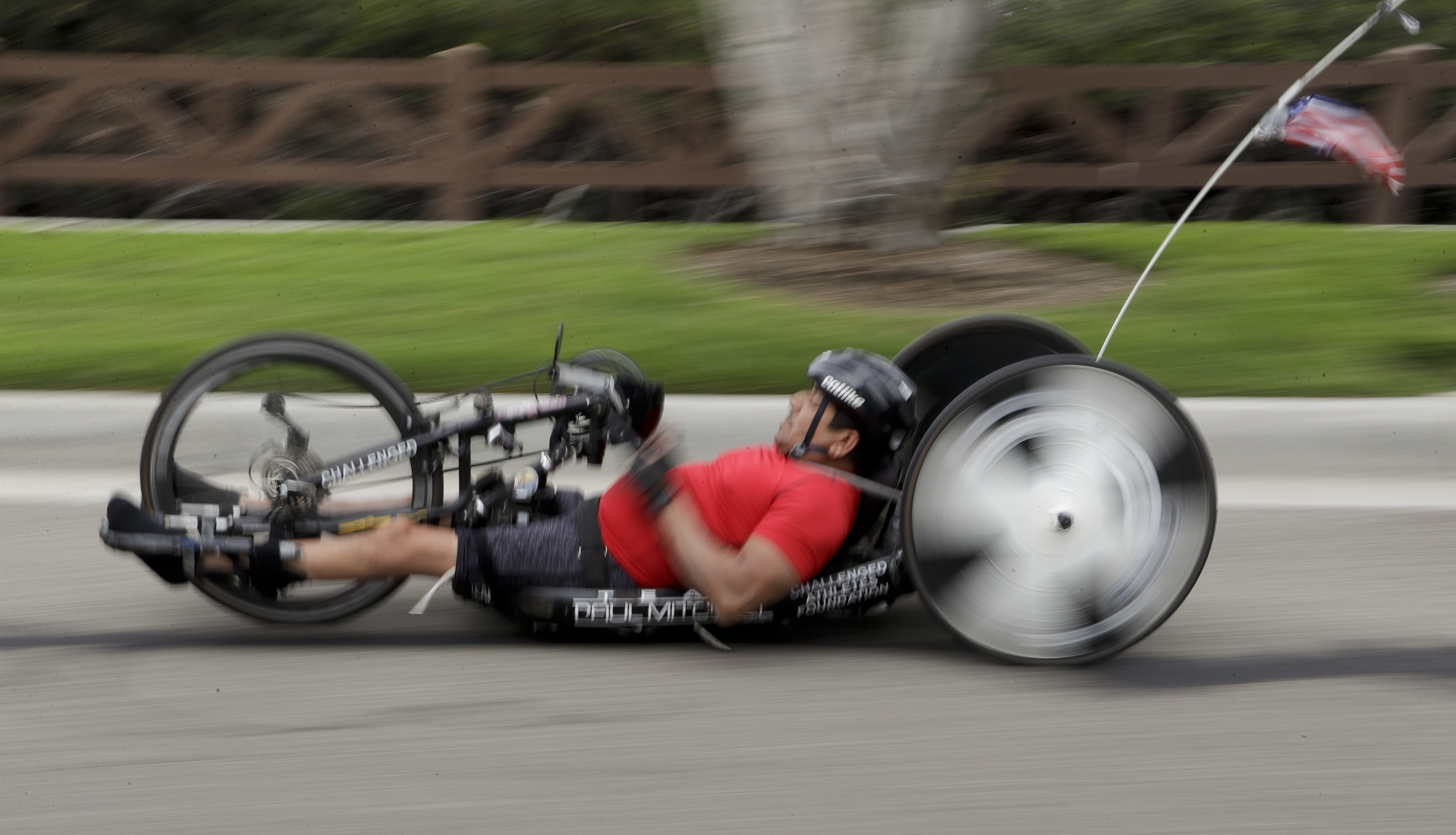 Endurance athlete overcomes paralysis to race, coach again