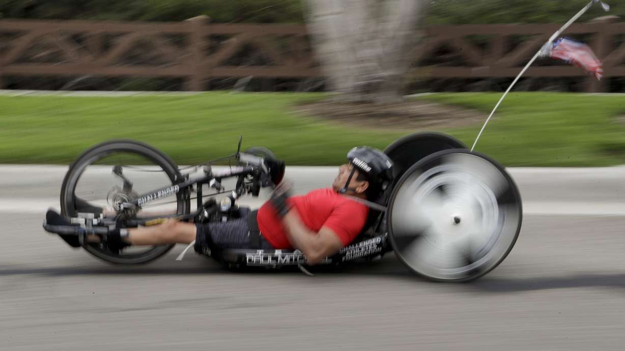 Endurance athlete overcomes paralysis to race, coach again