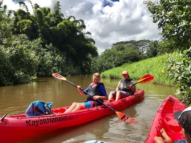 Emily Shoff and her son, Zach, paddle a stretch of the Hanalei River in Kauai. (Photo: Jake Shoff)